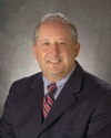 Board Member Carl D. DeYulis
