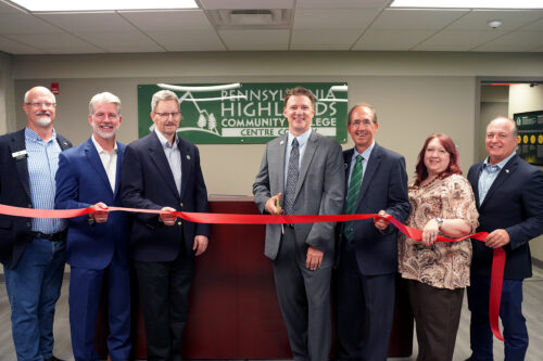 The ribbon cutting at the Penn Highlands Centre County location in Bellefonte, PA. This photo was taken at our reception desk. Left to right: Mark Higgins, Centre County Commissioner Chair; Greg Scott, President & CEO of the CBICC; Ralph Stewart, Borough of Bellefonte Manager; Dr. Steve Nunez, President of Pennsylvania Highlands Community College; Greg Winger, Pennsylvania Highlands Community College Board of Trustees Chairperson; Marissa Davis, Regional Center Director at Pennsylvania Highlands Community College; and Kerry Benninghoff, District 171 Pennsylvania State Representative.