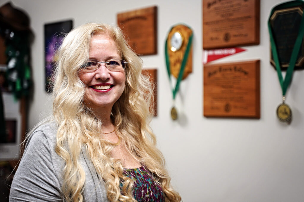 Posed photo of Professor Sandy Schrum in her office