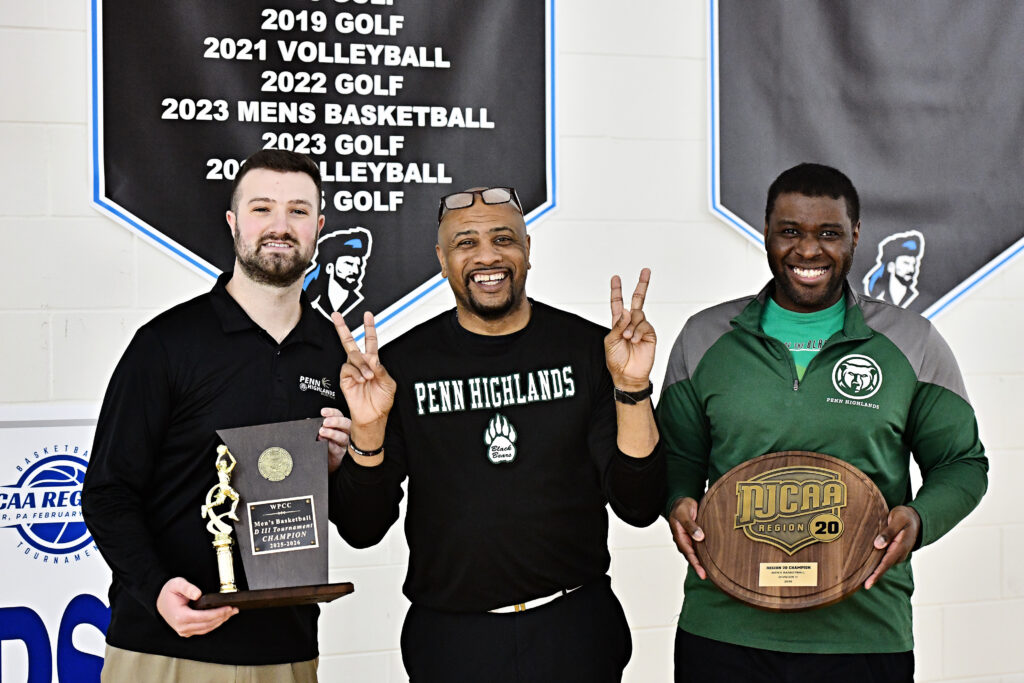 Penn Highlands Men's Basketball coaches Ben Mostoller, Chris Weakley, and Denzel Mobley pose for a photo following the WPCC/Region 20 Tournament Championship, Saturday, Feb. 21, 2026, at Butler County Community College.